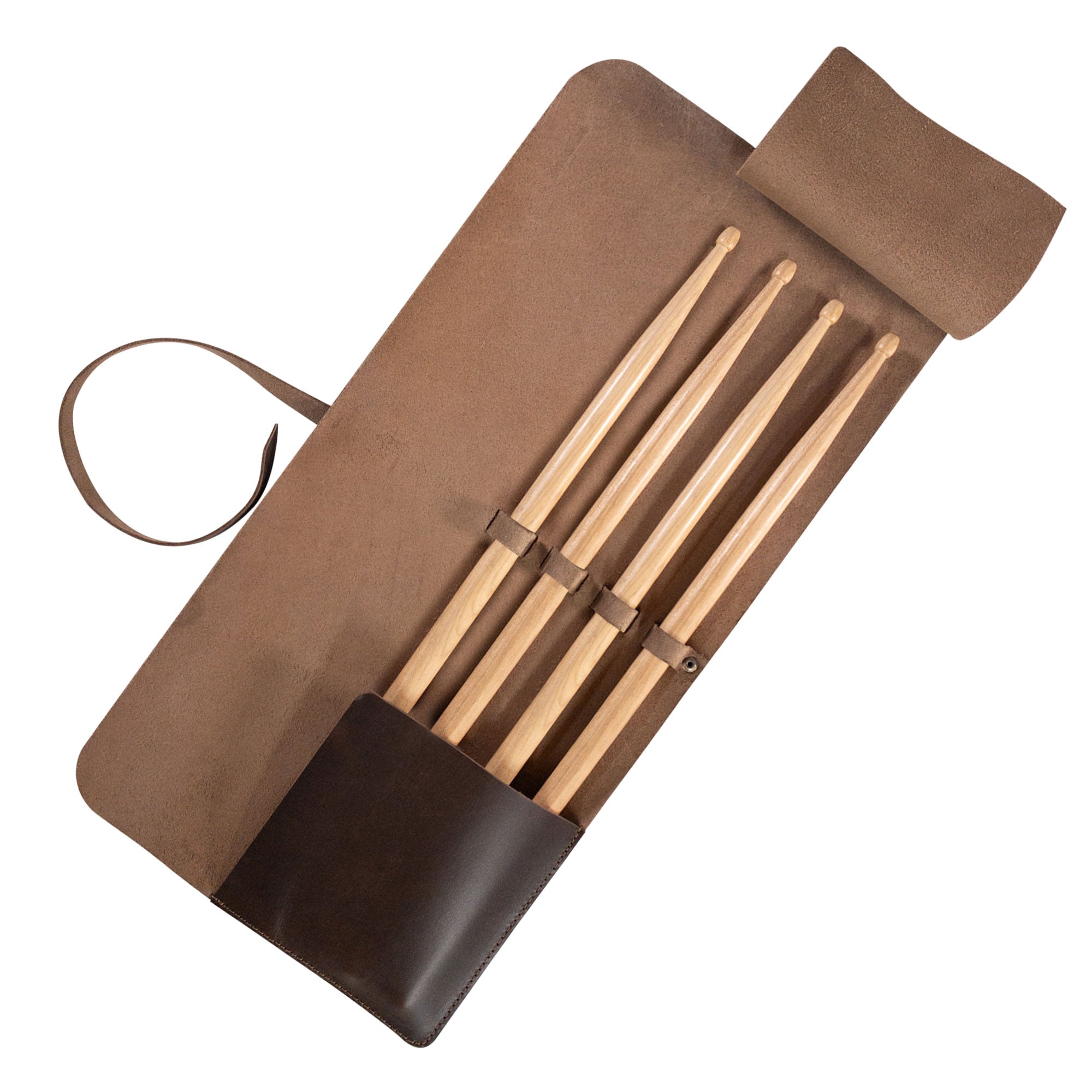 Drum Stick Roll from tocame, designed for drummers, showcasing a compact and stylish drum stick case made of Full Grain Leather. Ideal as a drum stick case with a drawstring, offering functionality and portability. Perfect accessory for drummers who appreciate artisan craftsmanship, handmade in La Antigua Guatemala.