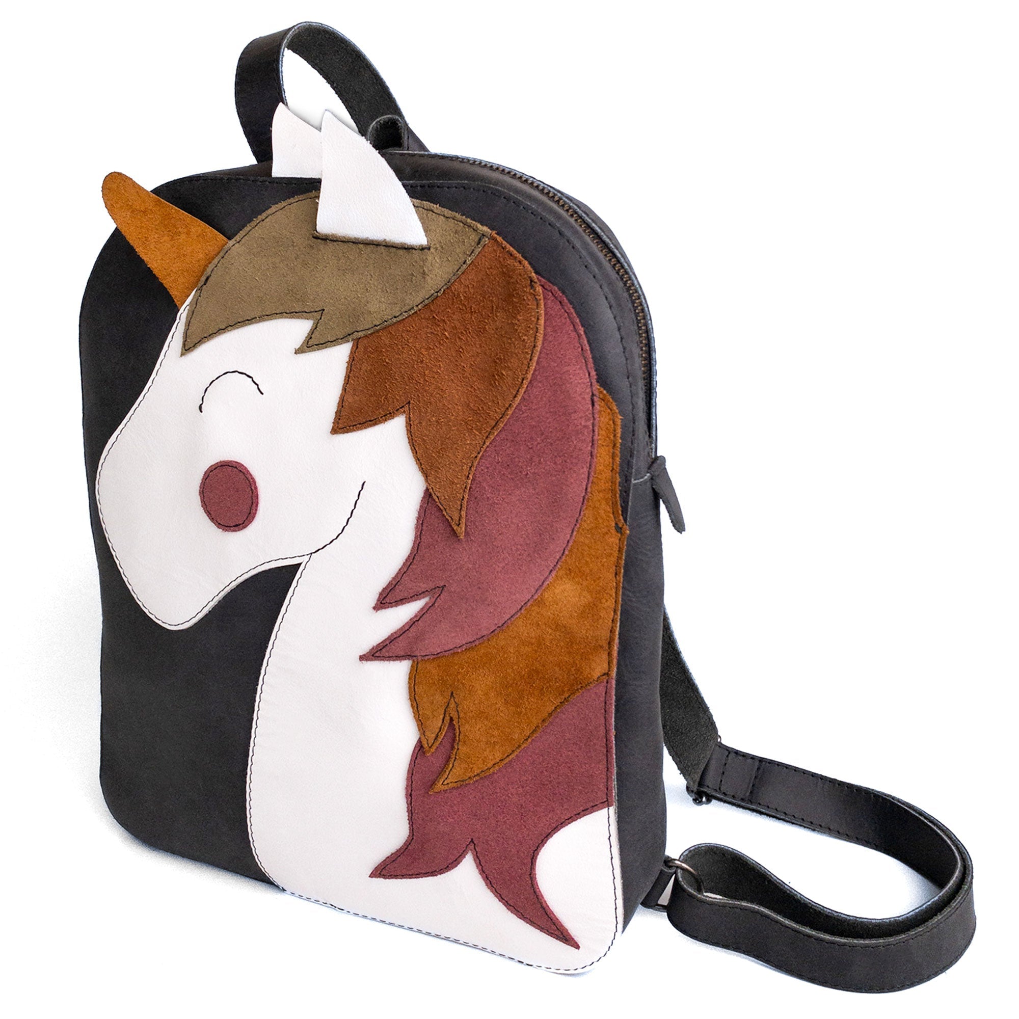 Hide & Play Daily Backpack with Unicorn Design featuring a colorful unicorn face in a whimsical yet practical style. This casual bag is made from full grain leather and perfect for everyday use as a messenger bag or travel bag for men and women. Handmade in La Antigua Guatemala, this small batch production backpack is artisan-crafted with hand-cut and hand-sewn techniques, ensuring quality and durability.