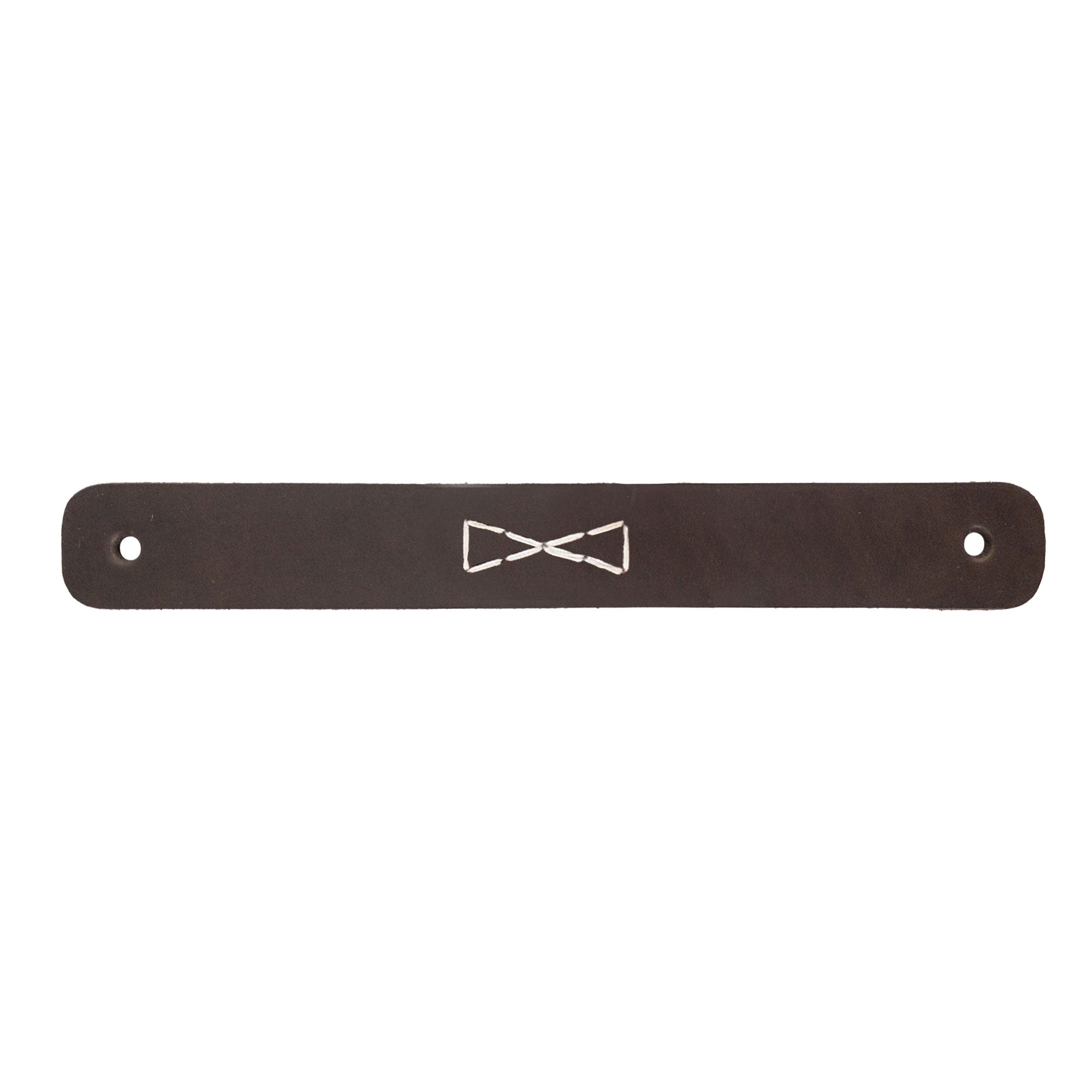 Close-up of a single Rectangular Drawer Handle with Bowtie Stitching Design, made from quality full grain leather by Hide & Drink. This handmade handle is part of the unique 4 Pack collection, emphasizing artisan techniques from La Antigua Guatemala & Oaxaca Mexico.