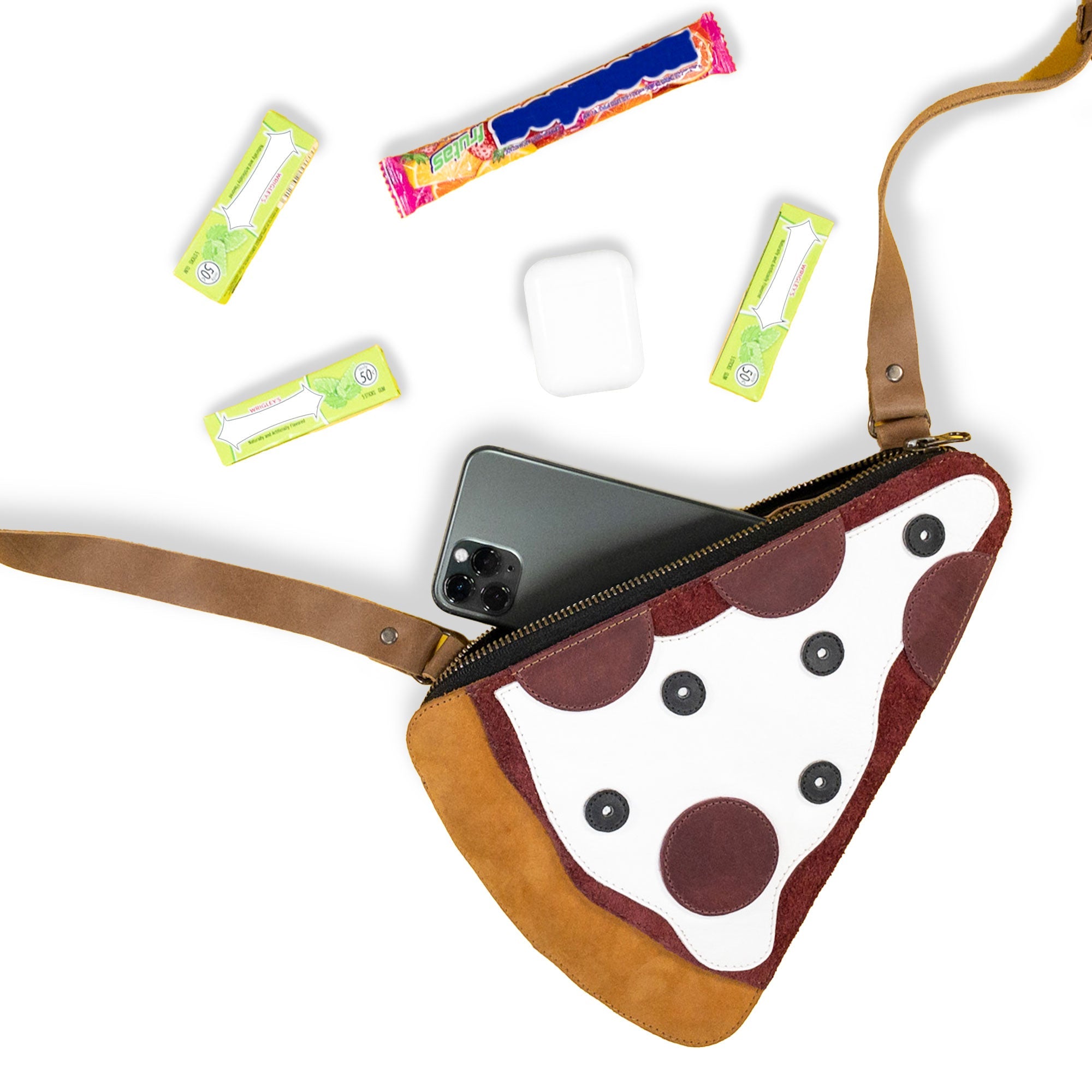 An open Pizza Slice-Shaped Shoulder Bag by Tudi Frudi showcasing the spacious interior, crafted from Full Grain Leather. This unique messenger bag is hand cut and fire branded, reflecting artisan skills from La Antigua Guatemala and perfect for stylish storage.