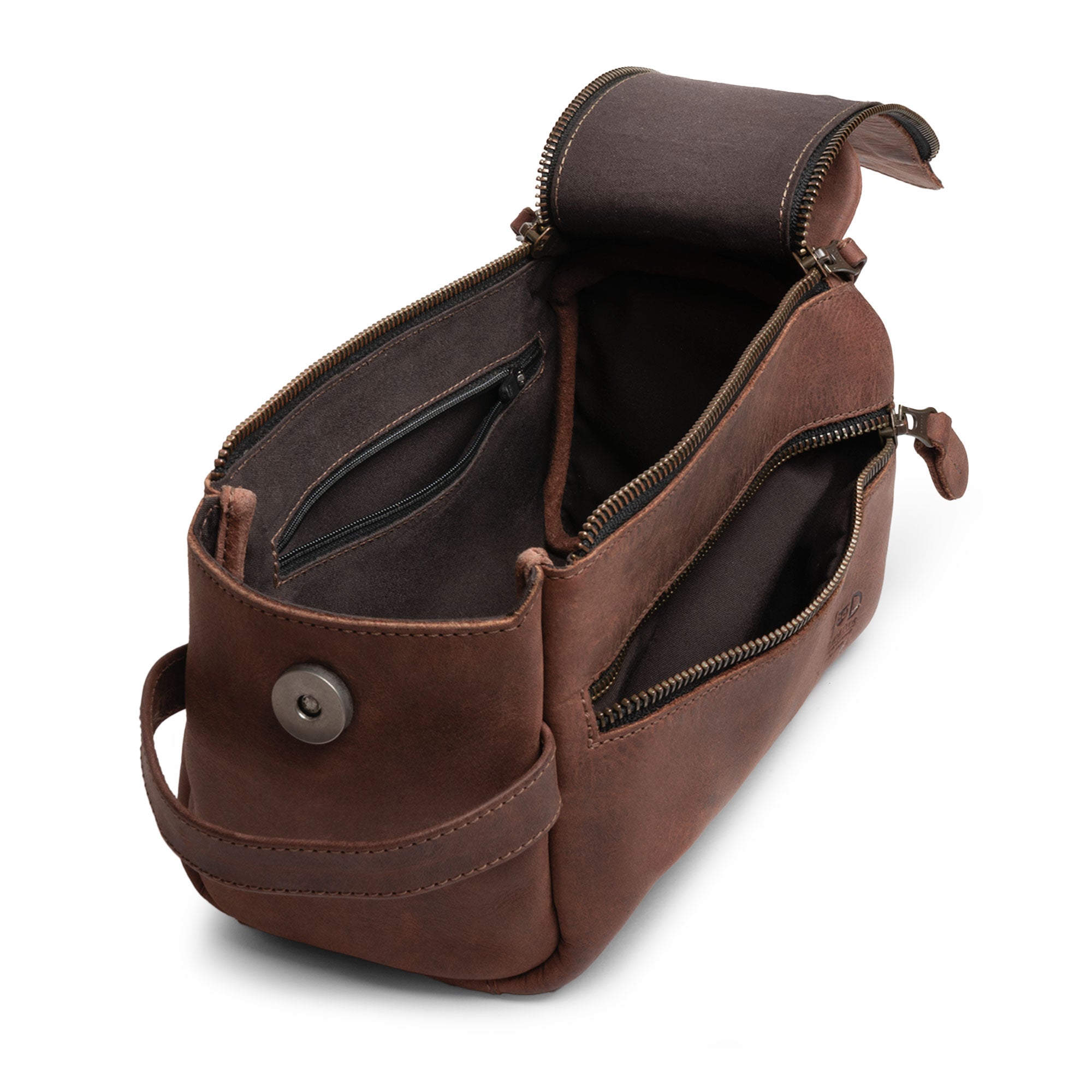 Interior view of Hide & Drink's Toiletry Bag, revealing ample space for essentials. This Full Grain Leather Toiletry Bag is a versatile Hand Bag for travel or daily use, functioning as a Dopp Kit Organizer. StockyardX, Handmade, S.