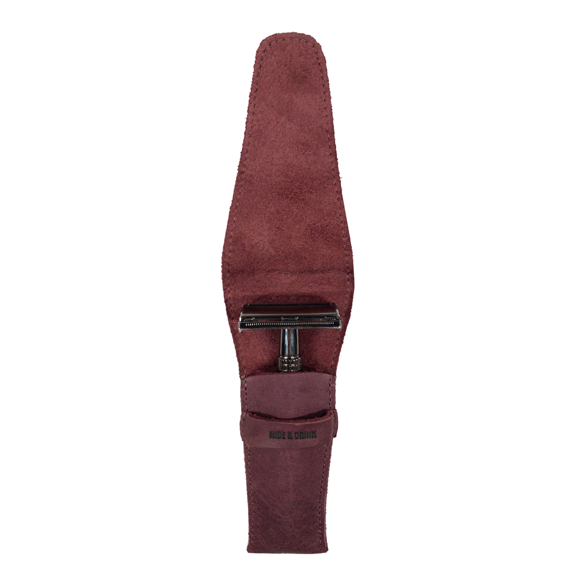 Hide & Drink's Safety Razor Case in a rich burgundy hue, designed to cradle your razor securely while adding sophistication to your grooming kit. Made from Full Grain Leather, this artisan piece embodies the care and craftsmanship of small batch production.