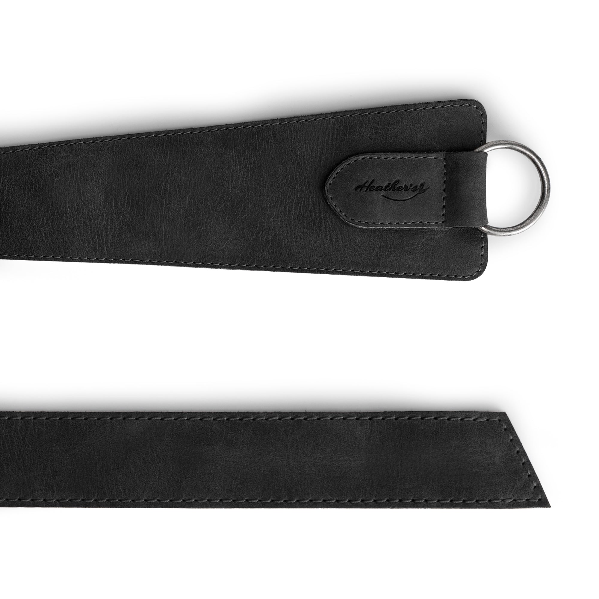 Close-up of Heather's Formal Belt for Women with Ring in black, featuring a streamlined design. Perfect as a belly accessory, this Full Grain Leather waist strap emphasizes the quality of small batch artisan craftsmanship in La Antigua Guatemala.