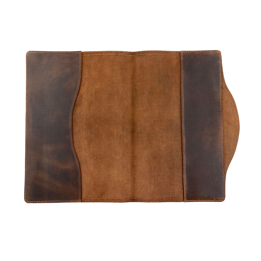 A close-up view of the Hard Cover Notebook Protector (Notebook NOT Included) by Hide & Drink, showcasing the soft interior leather. This journal cover is a perfect companion for Moleskine Hard Cover Sketchbook XXL Size (8.5 x 11 in.), not included. It features authentic Full Grain Leather craftsmanship from StockyardX with small batch production, hand cut, hand sewn, and fire branded by artisans. Handmade in La Antigua Guatemala & Oaxaca Mexico.