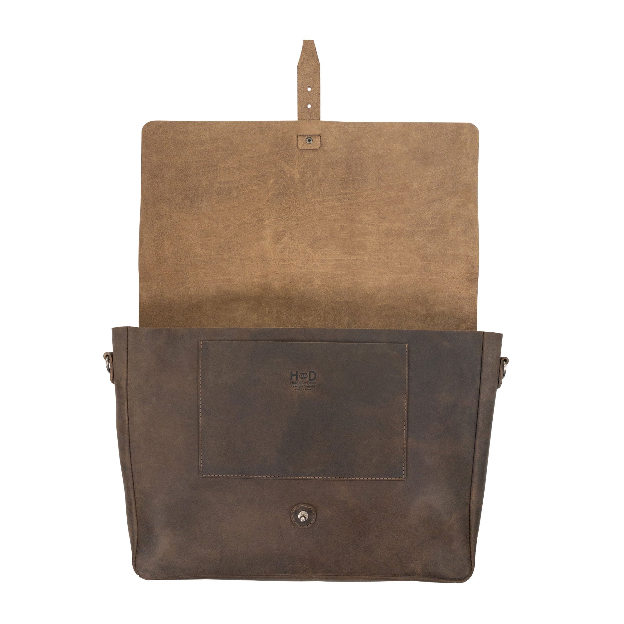Open view of Hide & Drink's Messenger Bag with Adjustable Strap featuring an interior pocket for organization. This messenger bag with shoulder strap is made from high-quality full grain leather, ideal for travelers and artisans alike, showcasing small batch production and handmade quality. Handmade in La Antigua Guatemala & Oaxaca Mexico.