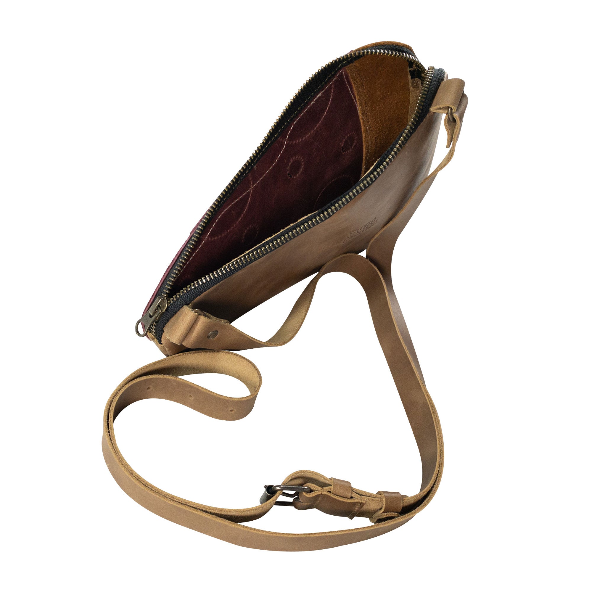 Side view of the Pizza Slice-Shaped Shoulder Bag by Tudi Frudi, showcasing the high-quality Full Grain Leather and adjustable strap. This unique bag is part of small batch production, hand sewn by artisans, making it a trendy crossbody option.