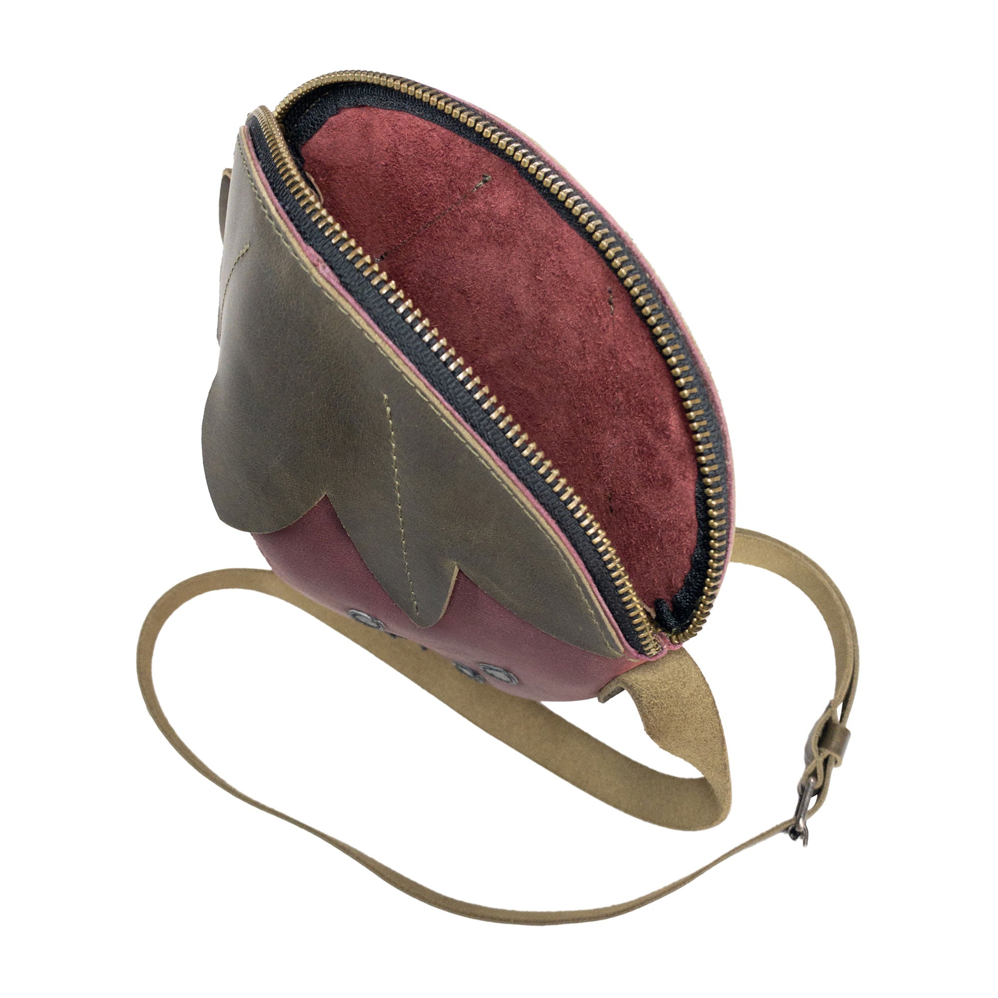 Open view of the Leather Strawberry-Shaped Shoulder Bag by Tudi Frudi, highlighting its zipper closure and spacious interior. This bag made from Full Grain Leather emphasizes the artisanal quality of small batch production, showcasing hand-cut and hand-sewn details, all handmade in La Antigua Guatemala & Oaxaca Mexico.