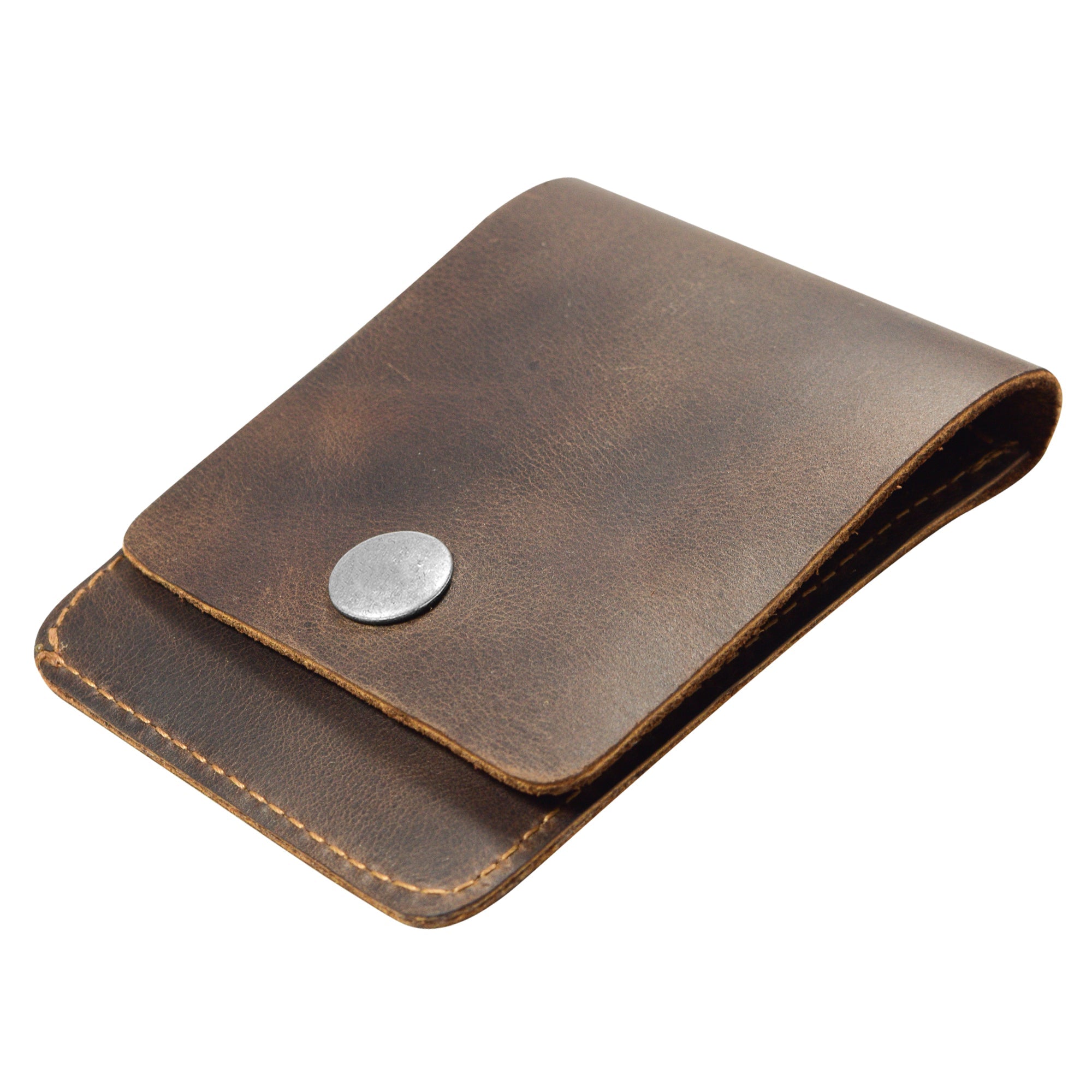 Side perspective of the Vertical Wallet by Hide & Drink, highlighting its slim and compact design. This Vertical Front Pocket Wallet with Card Slot is perfect for storing bills and cards, made from full grain leather through small batch production techniques, with hand cut and hand sewn detailing, fire branded by skilled artisans. Handmade in La Antigua Guatemala & Oaxaca Mexico.
