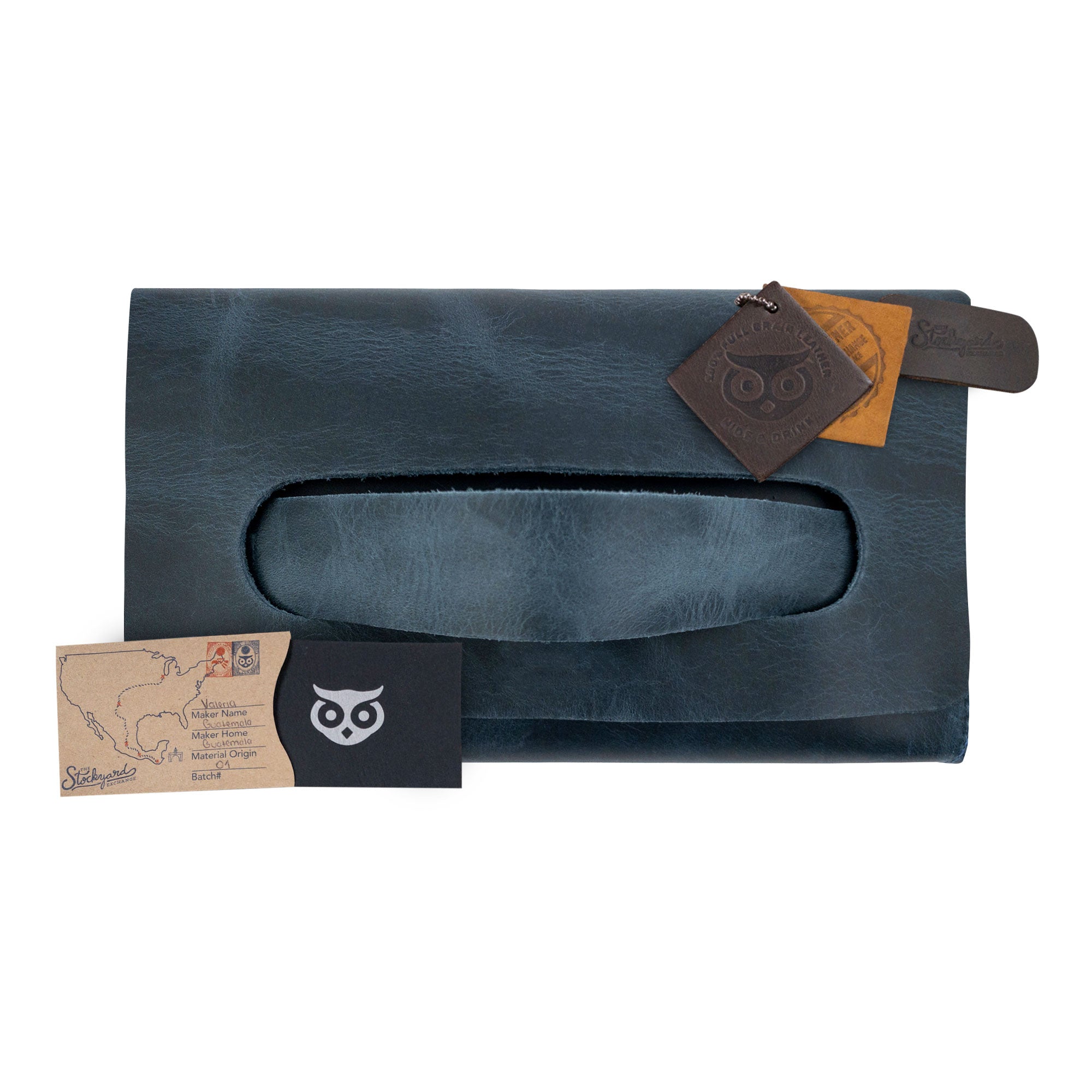 The navy Clutch Bag With Handle from Hide & Drink displayed with included accessories. This Full Grain Leather Clutch Bag is a stylish gift for women, crafted with care and precision in Guatemala and Mexico.
