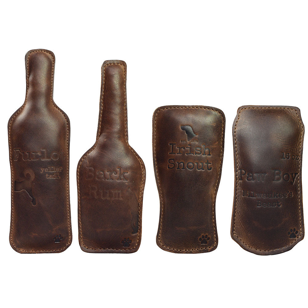 Chew Toy for Dogs Drinking Theme by Hide & Drink showcases four unique leather drink-themed chew toys for dogs, perfect for playful pups. This set features Dog Chew Toys (4 Pieces) / Drinks Chew Toy for Dogs made from durable full grain leather. Each toy is carefully crafted in small batch production, hand cut, hand sewn, and fire branded by artisans in La Antigua Guatemala & Oaxaca Mexico.