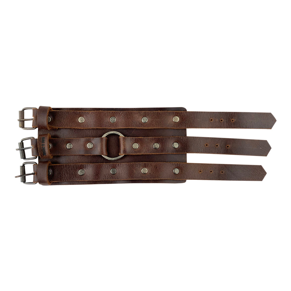 Flat view of the 3 Buckle Bracelet by Hide & Drink, highlighting its durable full grain leather construction. This men’s fashion accessory is a stylish and trendy wristband, designed for comfort and quality as part of small batch artisan production.