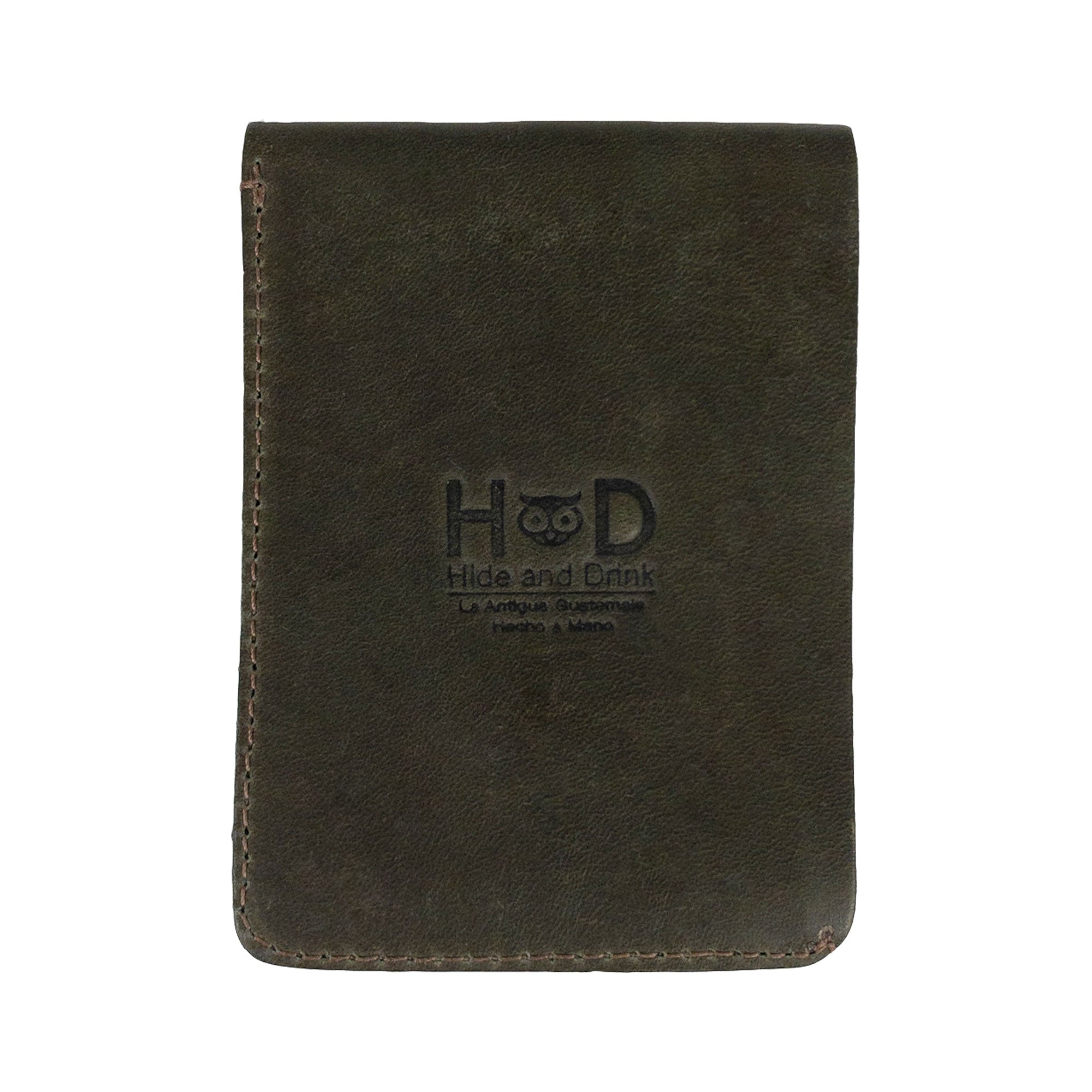 Opened green Vertical Wallet by Hide & Drink displaying card slots and cash compartment. This Vertical Front Pocket Wallet with Card Slot ensures compact storage for money and cards, crafted from full grain leather through small batch production methods with features like hand cut and hand sewn accents, fire branded by artisans. Handmade in La Antigua Guatemala & Oaxaca Mexico.