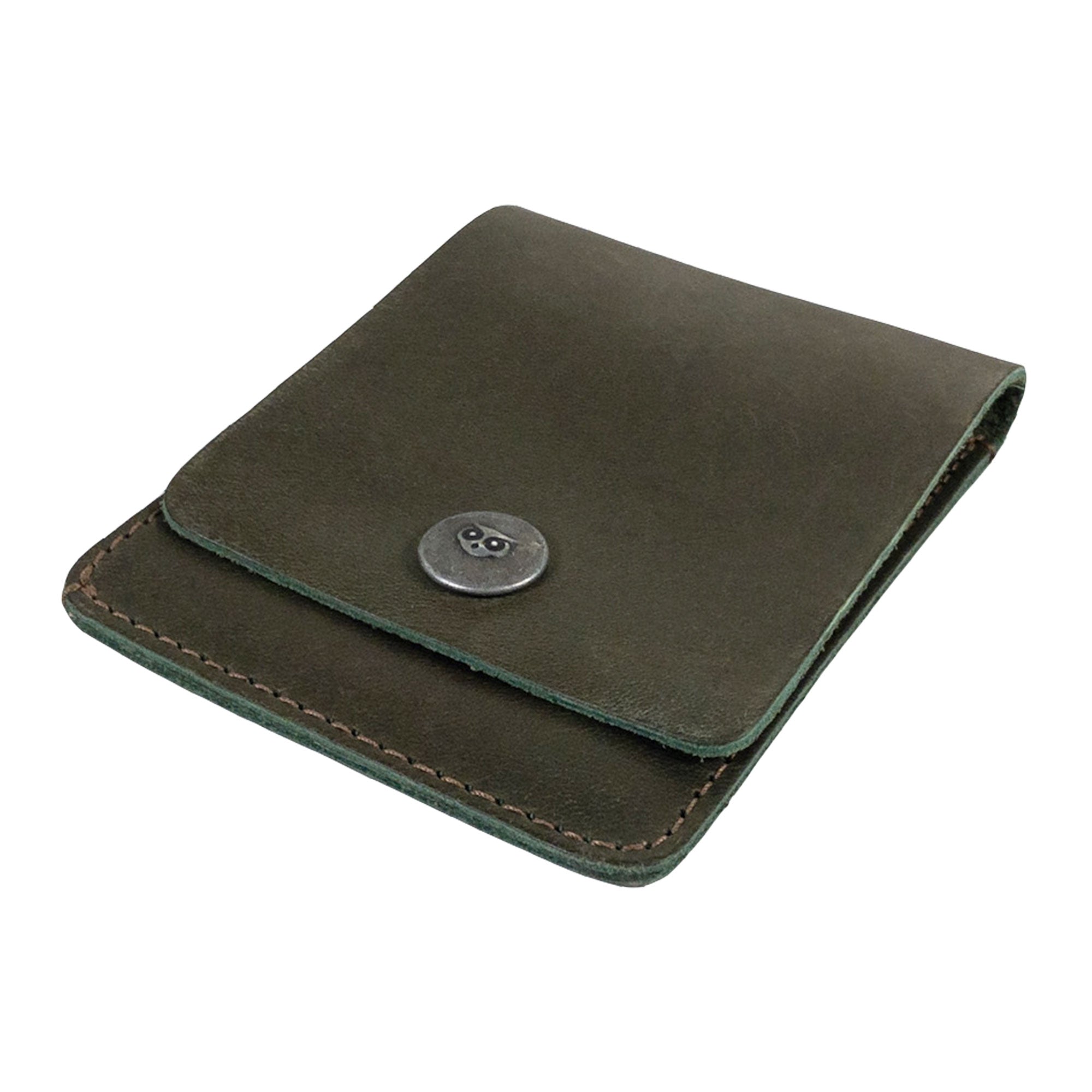 Interior view of the green Vertical Wallet by Hide & Drink, showcasing storage for cards and cash. This Vertical Front Pocket Wallet with Card Slot enhances compact storage solutions, crafted from premium full grain leather utilizing small batch production techniques, hand cut, and hand sewn carefully with fire branded elements. Handmade in La Antigua Guatemala & Oaxaca Mexico.
