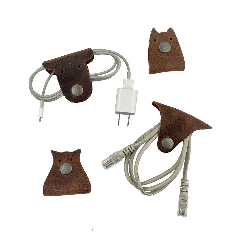Furry Friends Cord Keeper (4-Pack), showcasing cute designs to organize cables, made from high-quality full grain leather by Hide & Drink. Furry Friends 4-Pack Cord Keeper (Cord Clam), Full Grain Leather, StockyardX, Small Batch Production, Hand Cut, Hand Sewn, Fire Branded, Artisan, Handmade in La Antigua Guatemala & Oaxaca Mexico.