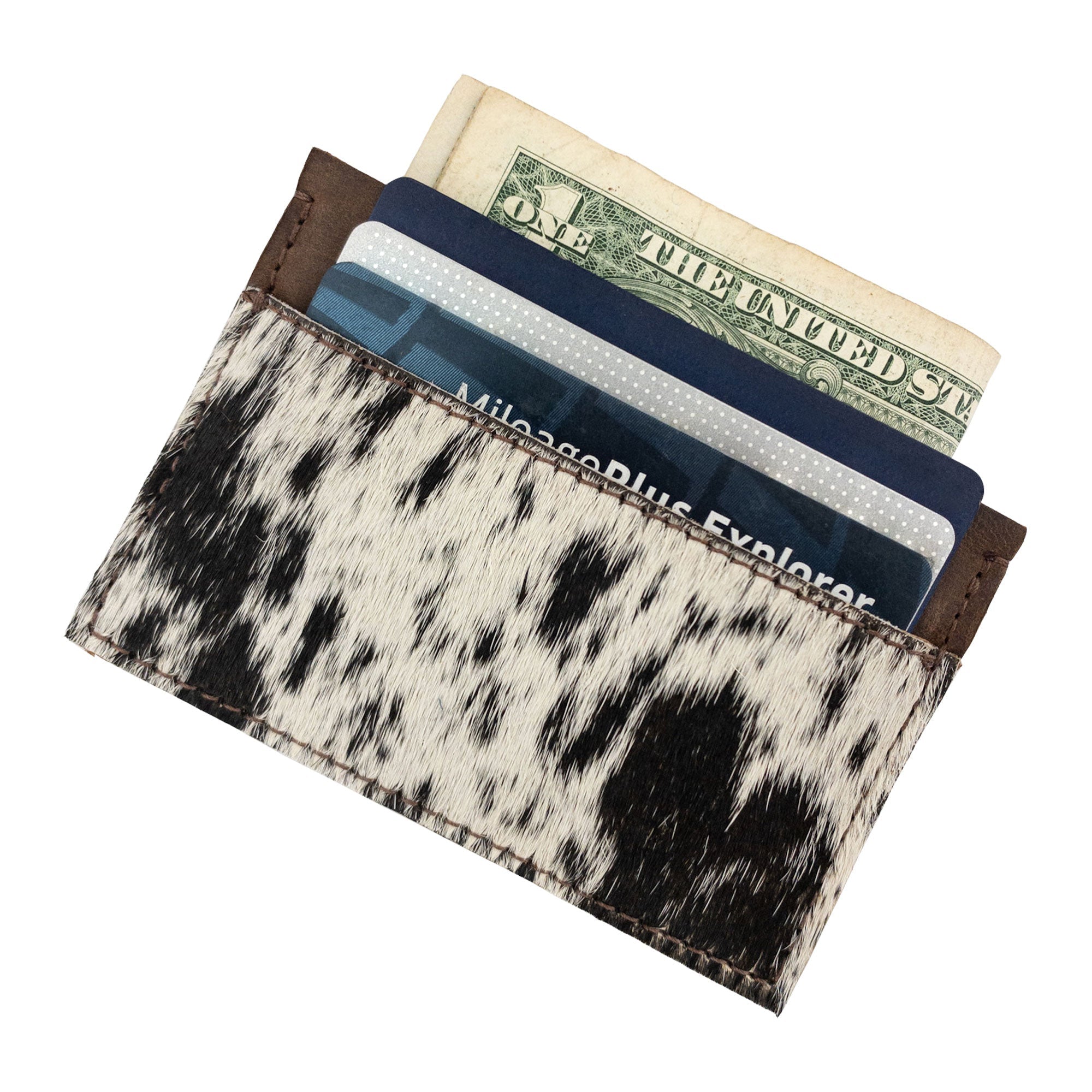 Western Leather Works Double Card Wallet displaying its capacity with cards and cash. This artisan-crafted product serves as a Compact Storage option and ideal ID holder for modern travelers. Made from high-quality full grain leather in La Antigua Guatemala, showcasing hand cut, hand sewn methods and a fire branded finish.