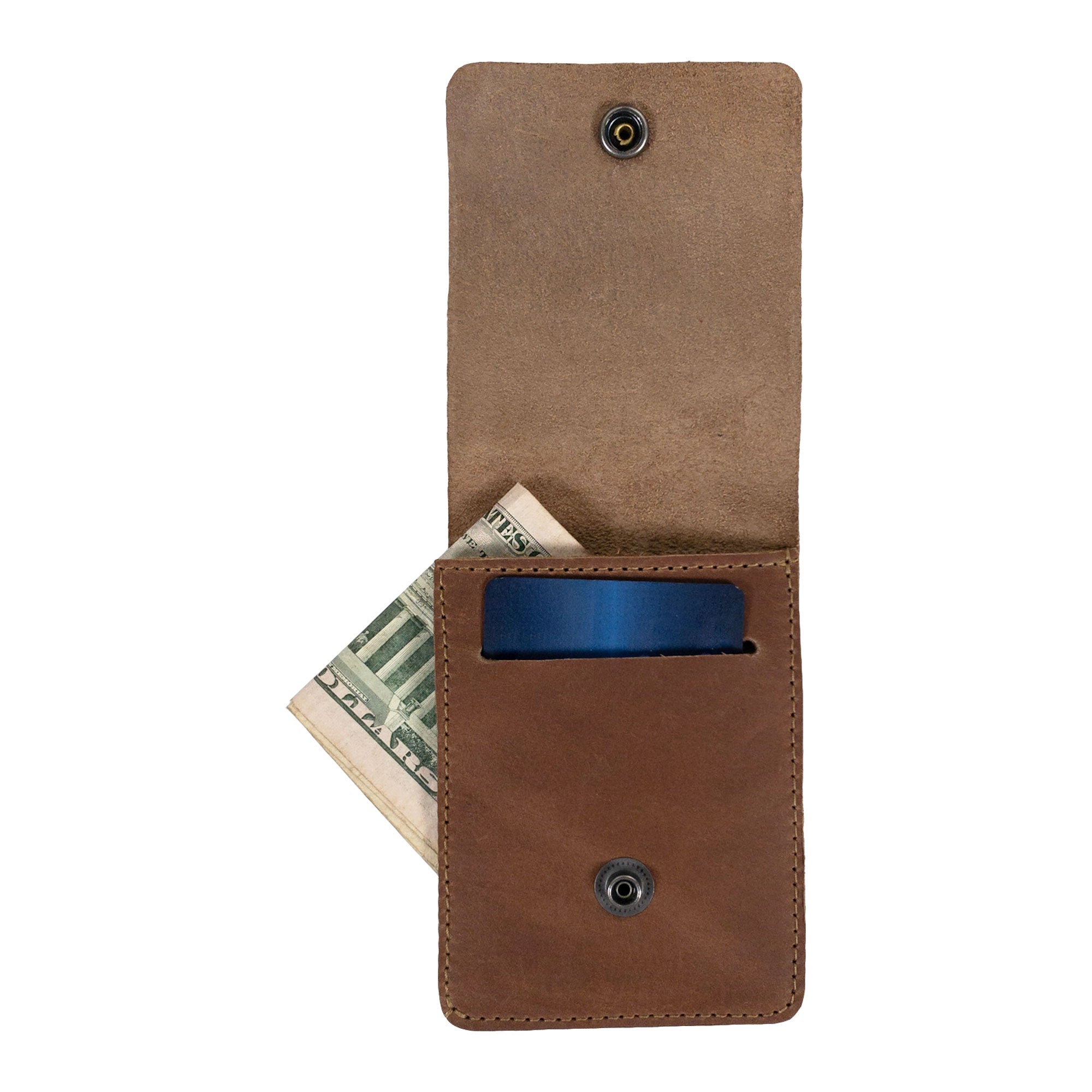 Side view of the brown Vertical Wallet by Hide & Drink illustrating its sleek and compact profile. This Vertical Front Pocket Wallet with Card Slot delivers efficient storage for bills while serving as a stylish card holder, crafted from full grain leather under small batch production, featuring hand cut and hand sewn details, fire branded for quality. Handmade in La Antigua Guatemala & Oaxaca Mexico.