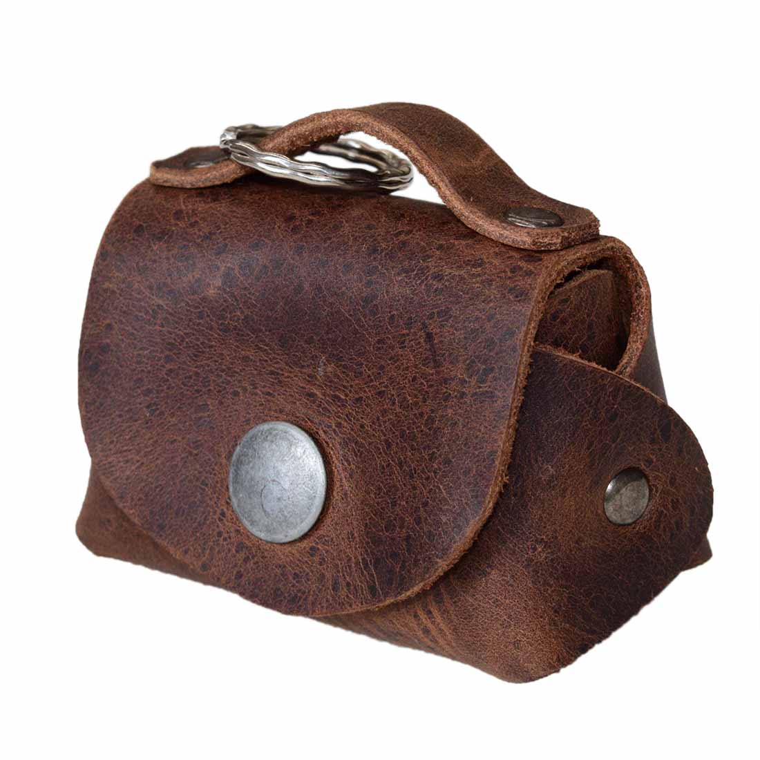 Tiny Handbag Keychain featuring a rustic design with key ring holder, crafted from full grain leather by Hide & Drink. This artisan-made Tiny Handbag with Key Ring Holder, Full Grain Leather, showcases small batch production, hand cut, hand sewn, and fire branded techniques, handmade in La Antigua Guatemala & Oaxaca Mexico.
