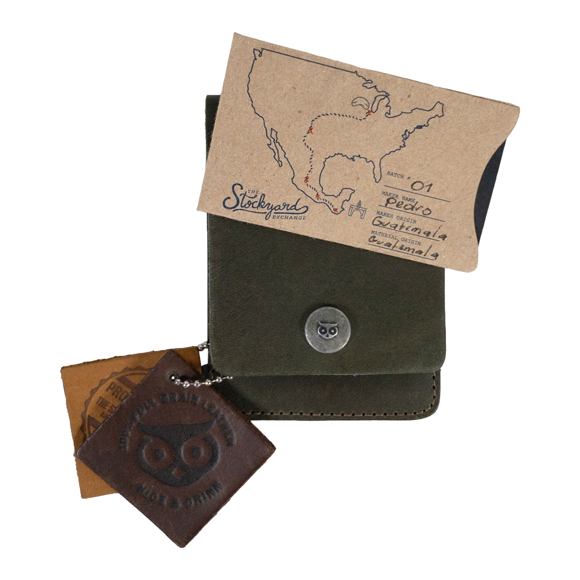 Vertical Wallet by Hide & Drink presented with business cards showcasing its daily utility. This Vertical Front Pocket Wallet with Card Slot is perfect for compact storage of cash and cards, crafted from full grain leather emphasizing small batch production, featuring hand cut, hand sewn details, and fire branded artistry. Handmade in La Antigua Guatemala & Oaxaca Mexico.
