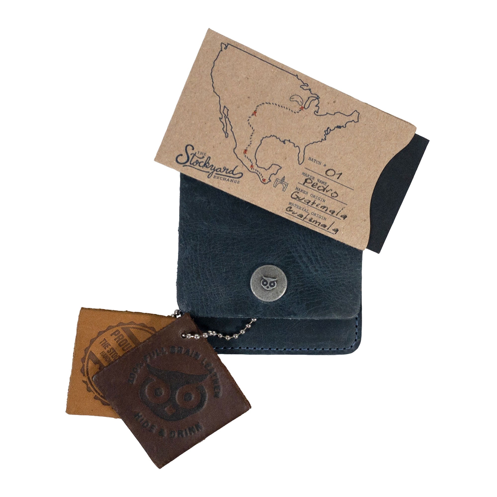 Vertical Wallet by Hide & Drink styled with business cards to illustrate daily utility. This Vertical Front Pocket Wallet with Card Slot offers compact storage options for money and cards, crafted from premium full grain leather showcasing small batch production, hand cut, hand sewn, and fire branded craftsmanship. Handmade in La Antigua Guatemala & Oaxaca Mexico.