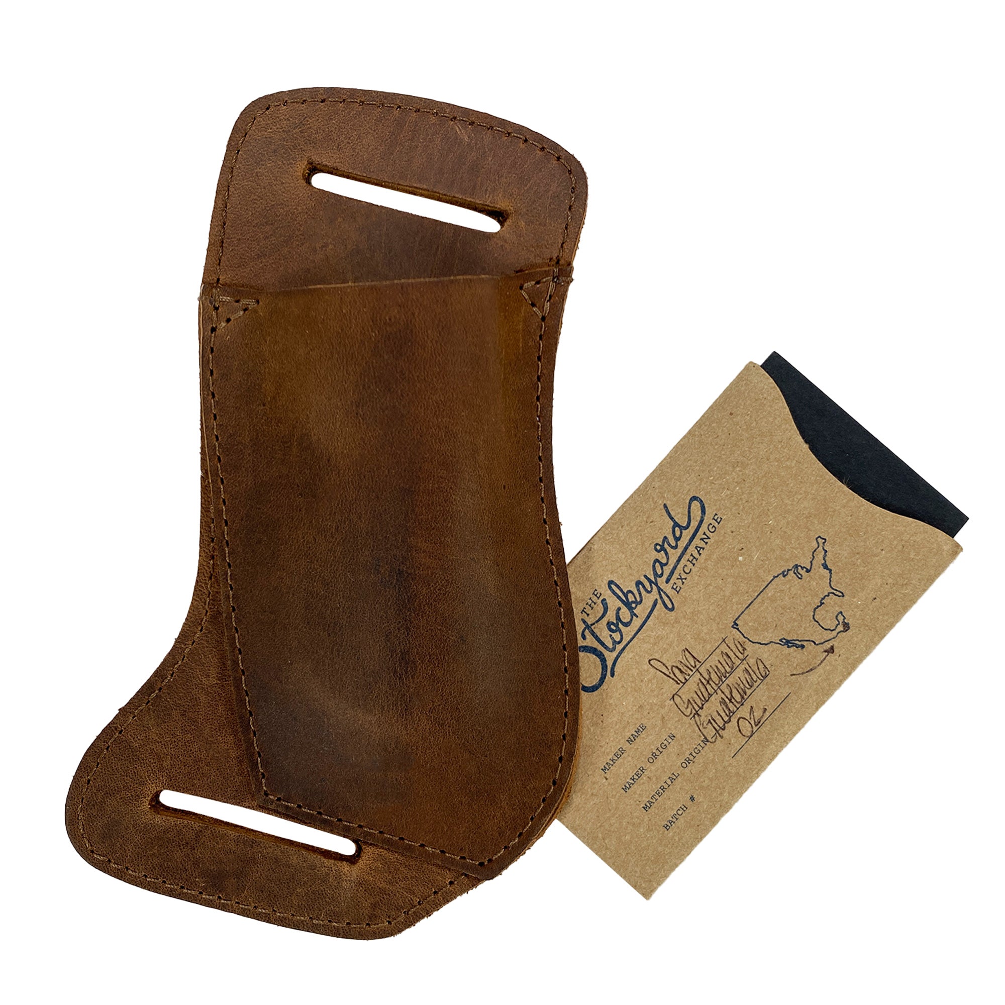 The Valhalla Gear Horizontal Knife Holster displayed with its packaging, underscoring its artisan quality and handmade craftsmanship, sourced from La Antigua Guatemala and Oaxaca Mexico, in premium full grain leather. This Horizontal Knife Holster - Multitool Holder, Tool Case, Camping & Outdoor Accessories, Full Grain Leather, StockyardX, Small Batch Production, Hand Cut, Hand Sewn, Fire Branded, Artisan, Handmade in La Antigua Guatemala & Oaxaca Mexico.