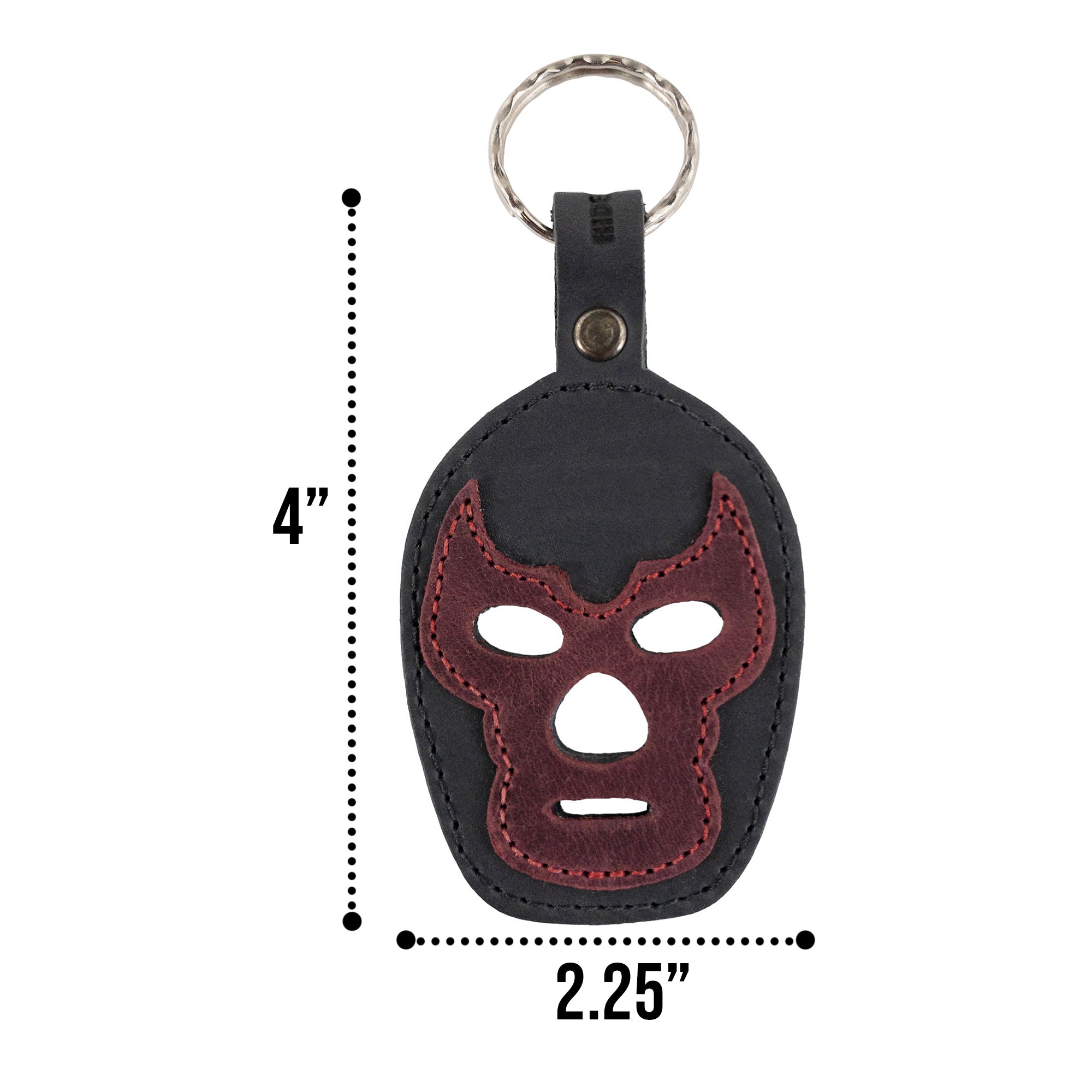 The Luchador Mask Leather Keychain displayed elegantly, highlighting its features as a keyring and travel accessory. From Hide & Drink, this key organizer is crafted from full grain leather, emphasizing the quality of small batch production. Each piece is hand cut, hand sewn, and fire branded, handmade in La Antigua Guatemala and Oaxaca Mexico.