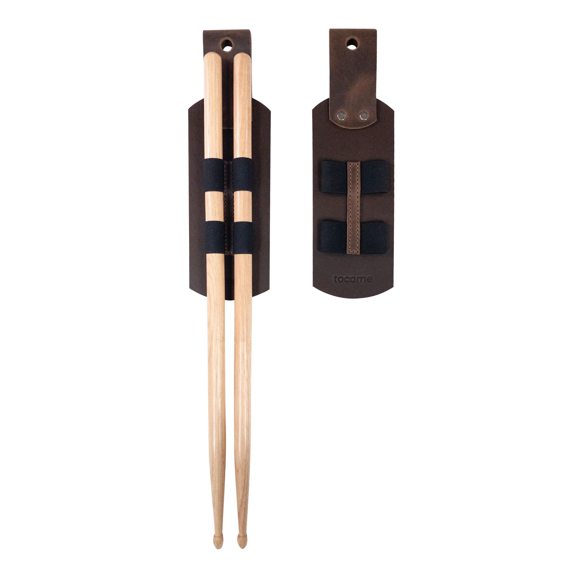 Set of 2 Drum Stick Sleeves by tocame, showcasing a pair of rustic hanging sleeves designed to hold drumsticks. Made from full grain leather, these handmade drum stick holders are an artisan product from La Antigua, Guatemala, featuring a unique fire-branded finish. Ideal for musicians looking for a stylish stick case.