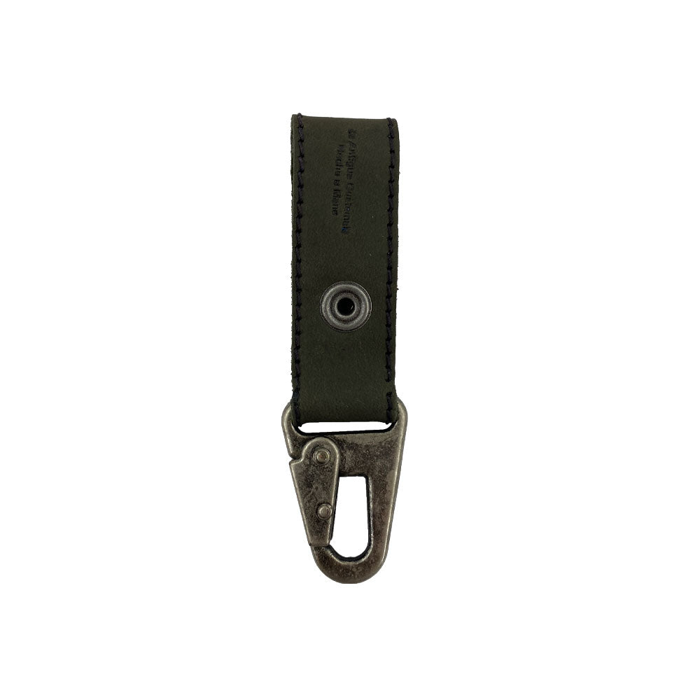 Close-up view of a rustic Key Ring Holder by Hide & Drink, showcasing Full Grain Leather with a strong metal snap. This artisan handmade accessory from StockyardX features small batch production techniques, hand-cut and hand-sewn details, and is fire branded, made in La Antigua Guatemala & Oaxaca Mexico.