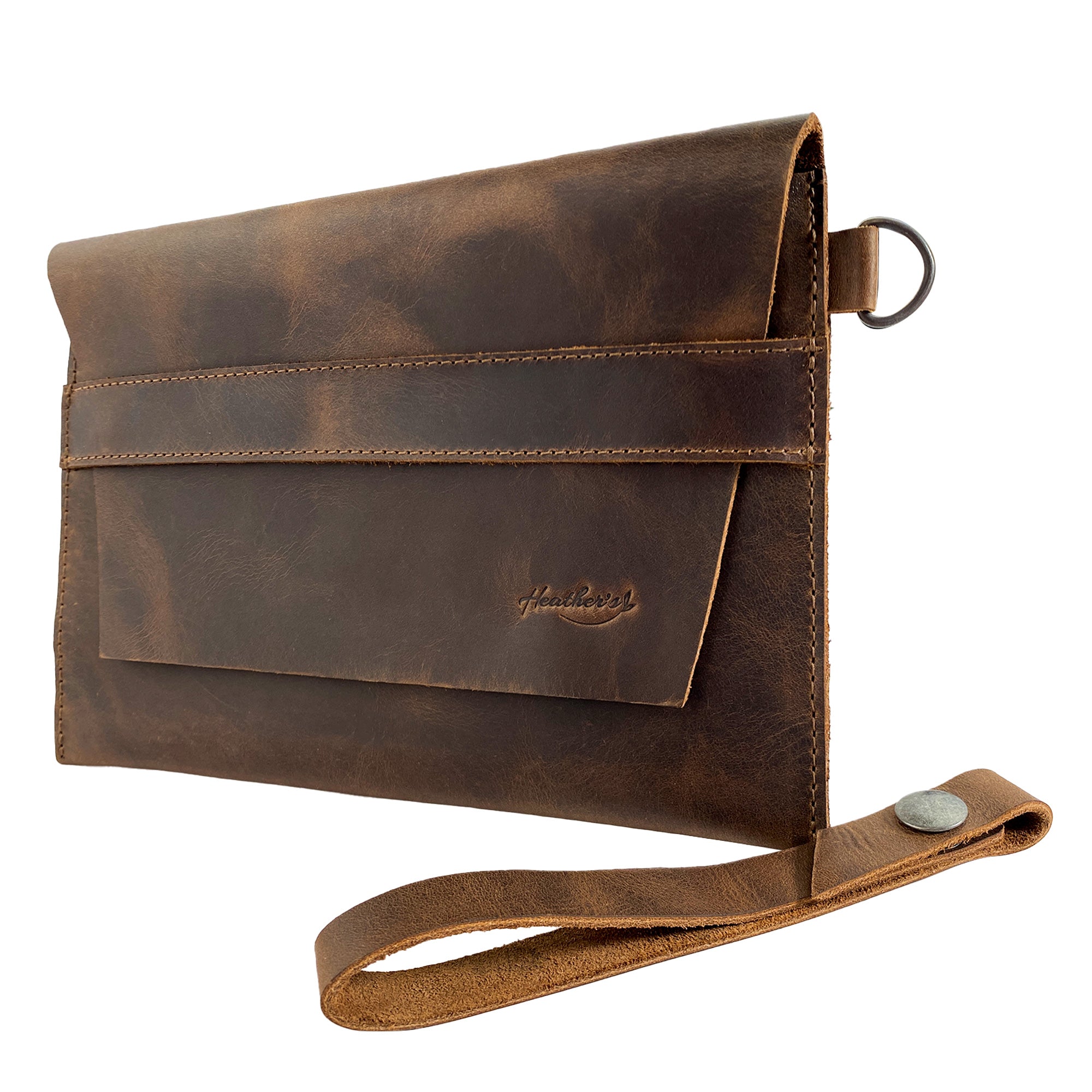 Heather's Vintage Clutch Bag presented at an angle, designed as a versatile wrist wallet for cards, money, and coins. This handmade clutch utilizes premium full grain leather, demonstrating the artisanal approach of small batch production in La Antigua Guatemala & Oaxaca Mexico.
