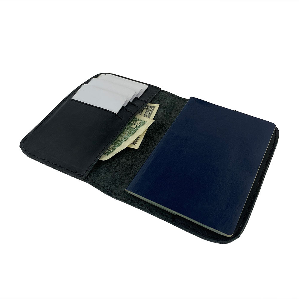 Inside view of the Hide & Drink Travel Wallet, featuring practical slots for cards and cash. This travel wallet acts as a stylish bifold passport case, artisan-made in La Antigua Guatemala.
