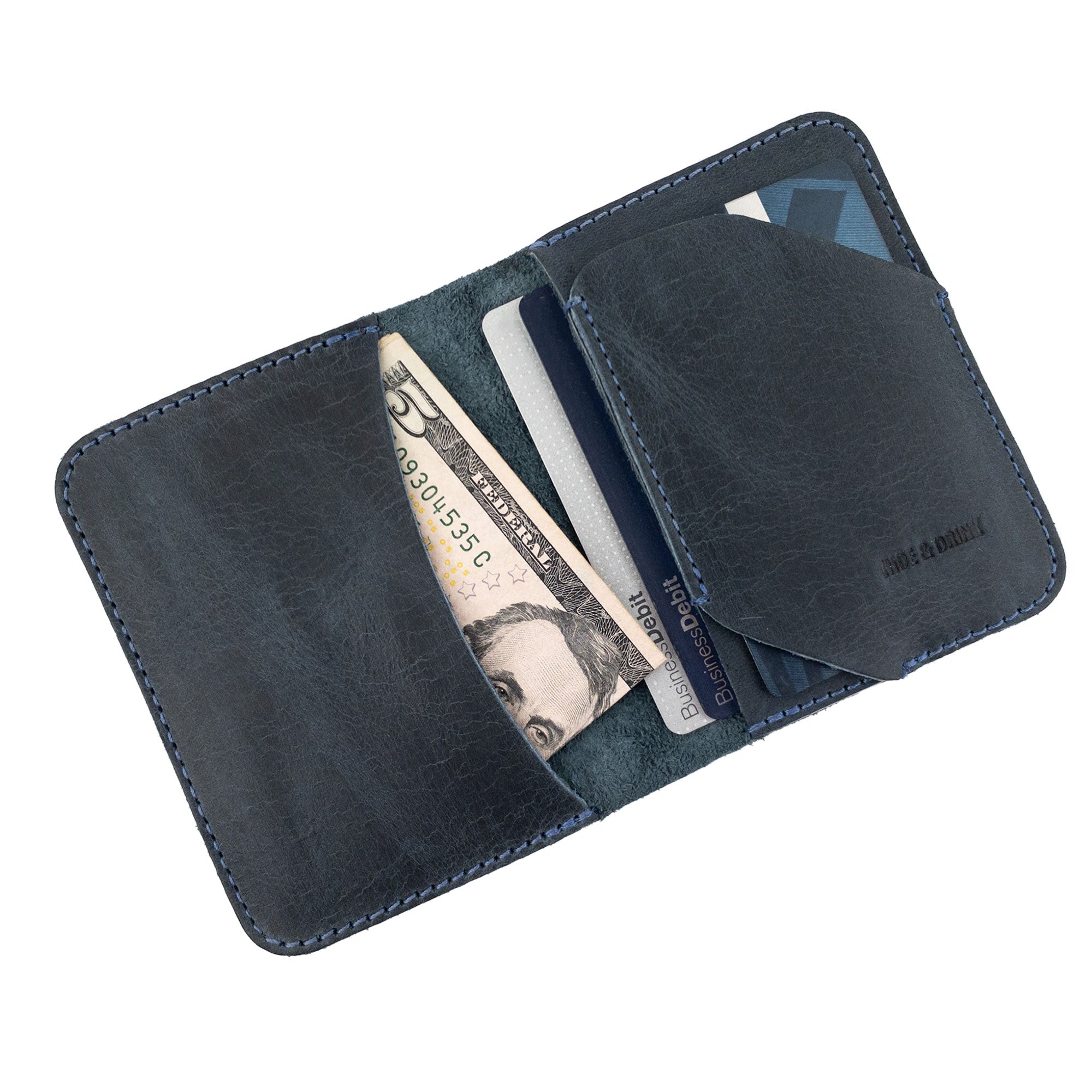 Bi-Fold Card Wallet Diagonal by Hide & Drink showcasing tags and packaging, highlighting its artisan quality and commitment to handmade craftsmanship.