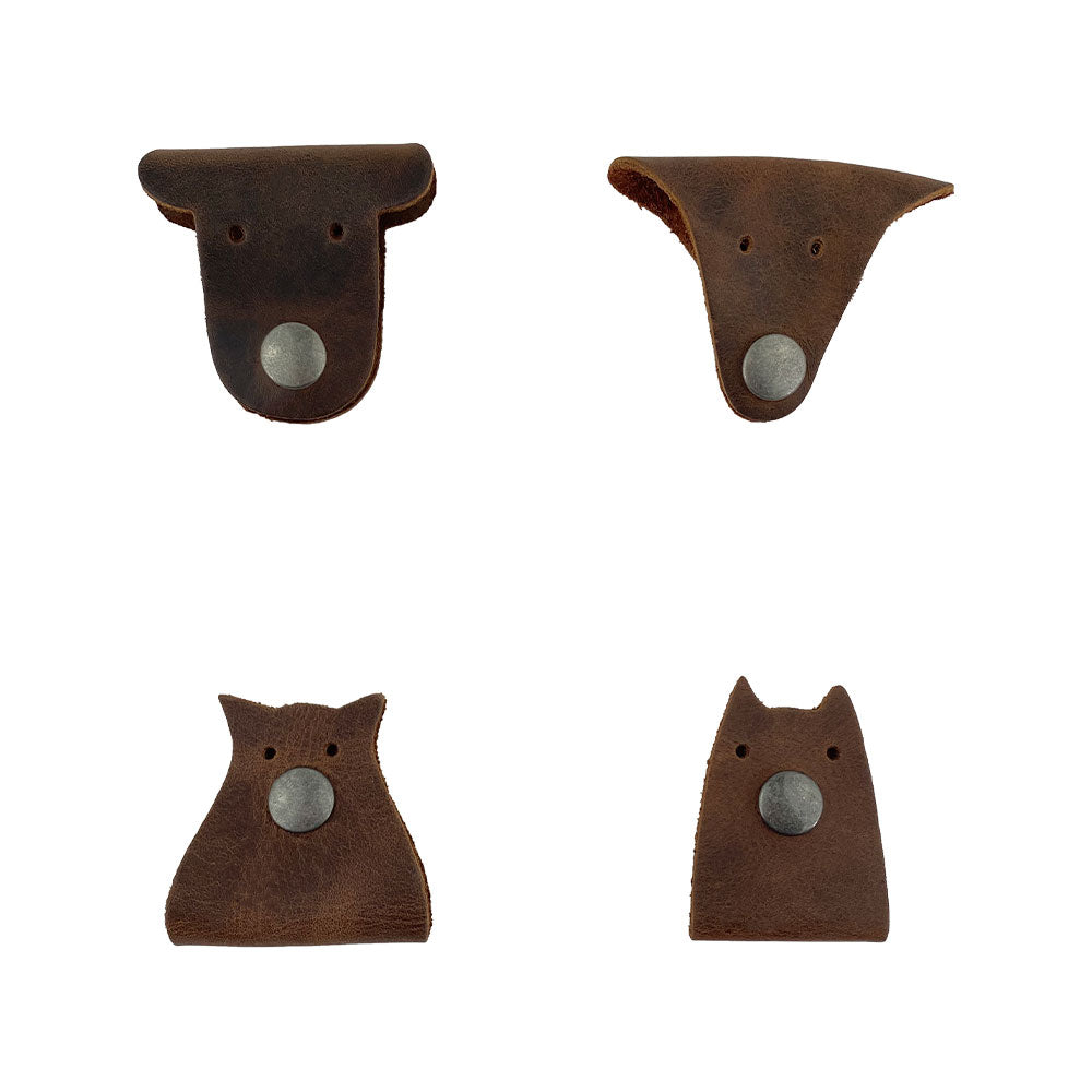 Furry Friends Cord Keeper (4-Pack), showcasing unique designs for managing cords, crafted from durable full grain leather by Hide & Drink, perfect for keeping cables tidy. Furry Friends 4-Pack Cord Keeper (Cord Clam), Full Grain Leather, StockyardX, Small Batch Production, Hand Cut, Hand Sewn, Fire Branded, Artisan, Handmade in La Antigua Guatemala & Oaxaca Mexico.