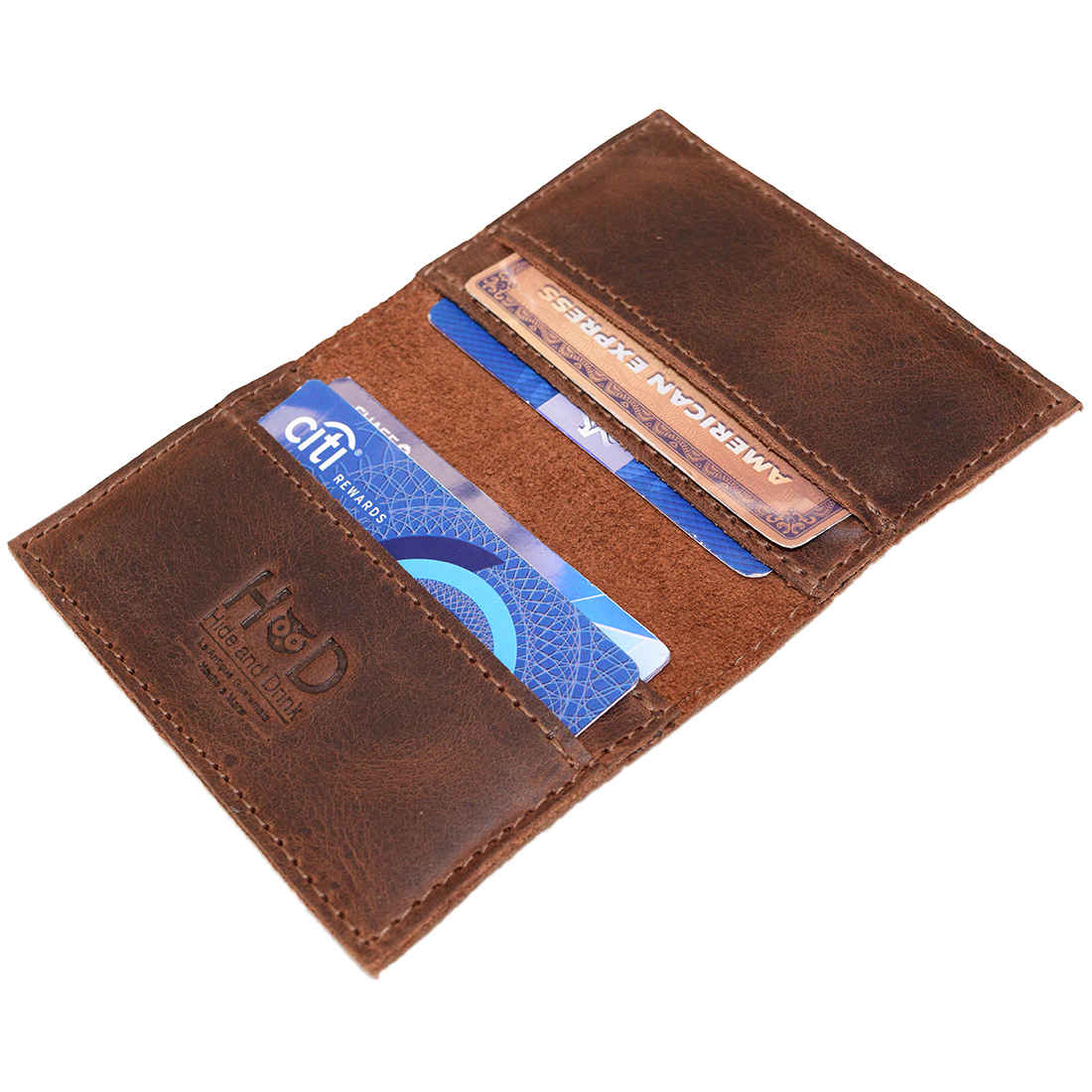 Bifold Horizontal Card Wallet by Hide & Drink, showcasing its interior with space for up to 8 cards, designed as a minimalist traveller wallet, organizer in vintage style, made from full grain leather, reflecting the craft of small batch production, hand cut and hand sewn, fire branded, and artisan techniques, handmade in La Antigua Guatemala & Oaxaca Mexico.