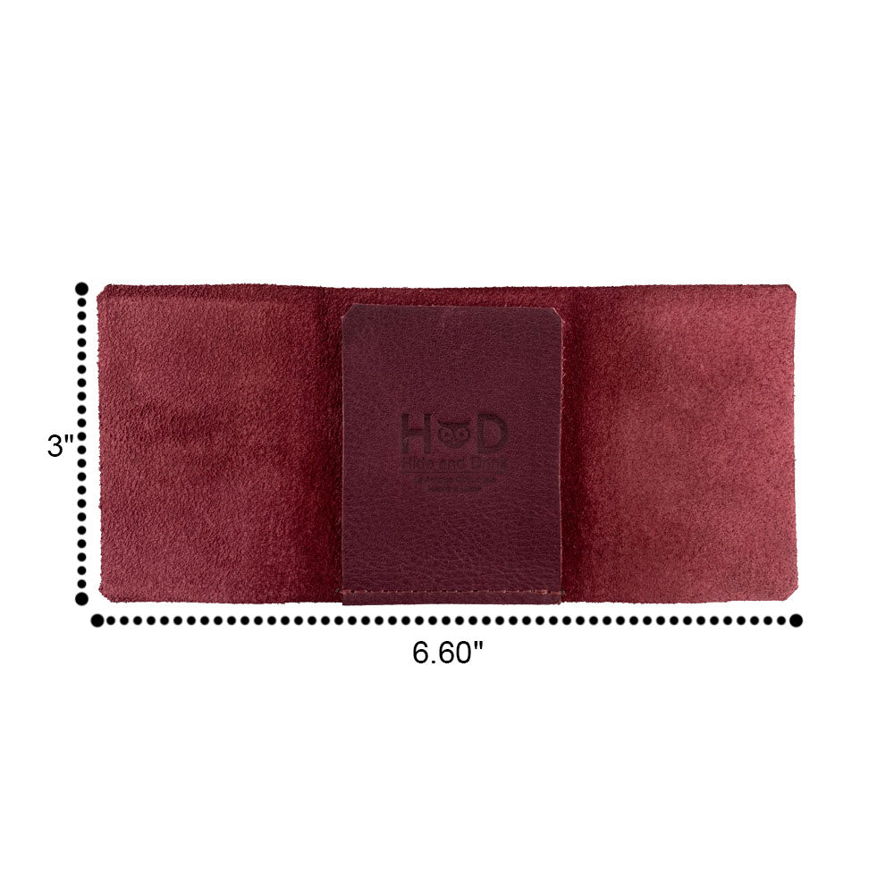 The Hide & Drink Minimalist Wallet Bills Only open displaying bills, taking shape as an Ultra Minimalist Wallet. Crafted from durable Full Grain Leather, it exemplifies a cash organizer handmade by artisans dedicated to quality.