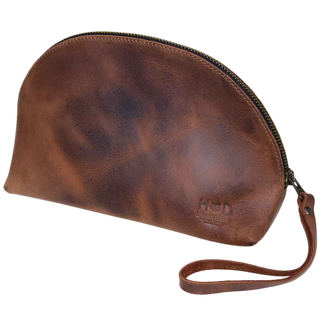 A stylish Accessory Pouch Organizer Hand Bag by Hide & Drink, made from rich full grain leather. This Cosmetic Travel Organizer with Hand Strap for Women is perfect as a Makeup Bag or Classic Handbag. It's hand cut, hand sewn, and artisan crafted in La Antigua Guatemala & Oaxaca Mexico, ensuring durability and timeless appeal.
