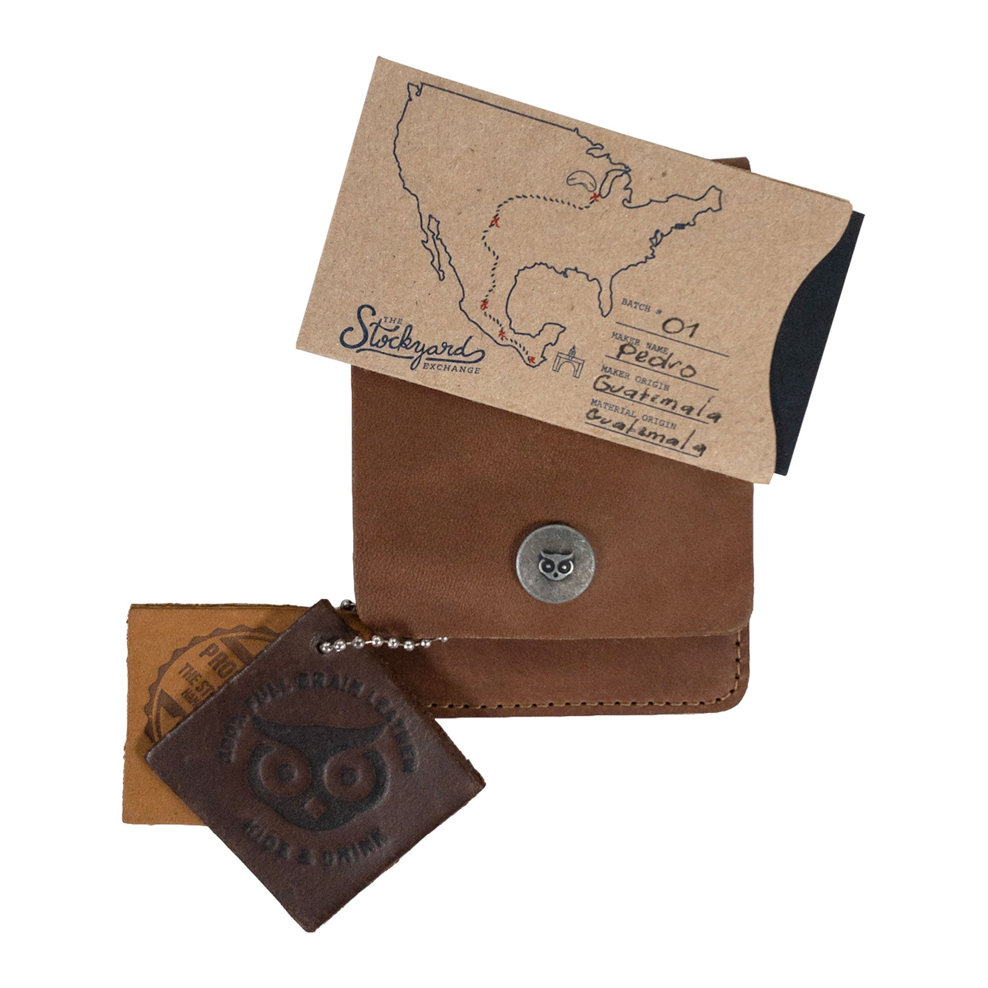 Vertical Wallet by Hide & Drink styled with business cards to showcase versatility. This Vertical Front Pocket Wallet with Card Slot presents compact storage solutions for bills and cards, made from durable full grain leather, emphasizing small batch production, hand cut, hand sewn with fire branding for a stylish touch. Handmade in La Antigua Guatemala & Oaxaca Mexico.