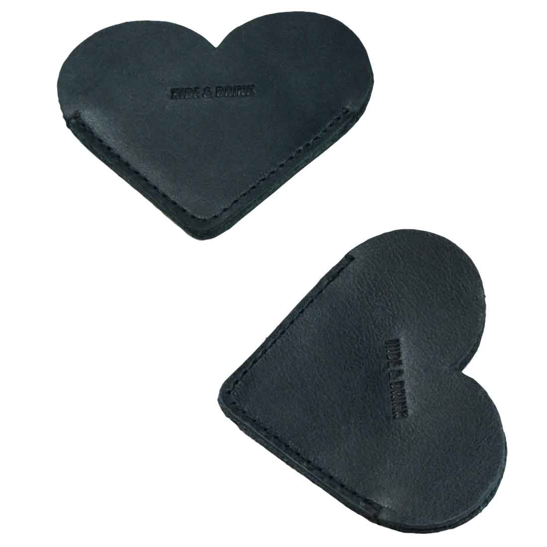 Two black Leather Corner Heart Bookmarks (2 pack) by Hide & Drink, designed with Full Grain Leather for durability. These bookmarks are handcrafted in La Antigua Guatemala and Oaxaca Mexico, demonstrating artisan quality and small batch production.